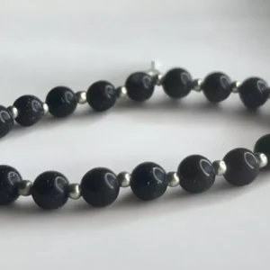 Pulsera de Lluvia de Estrellas y Perla Metálica: Elegancia Mística con un Toque Moderno