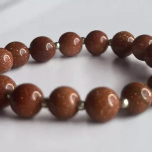 Pulsera piedra sol con perla metálica