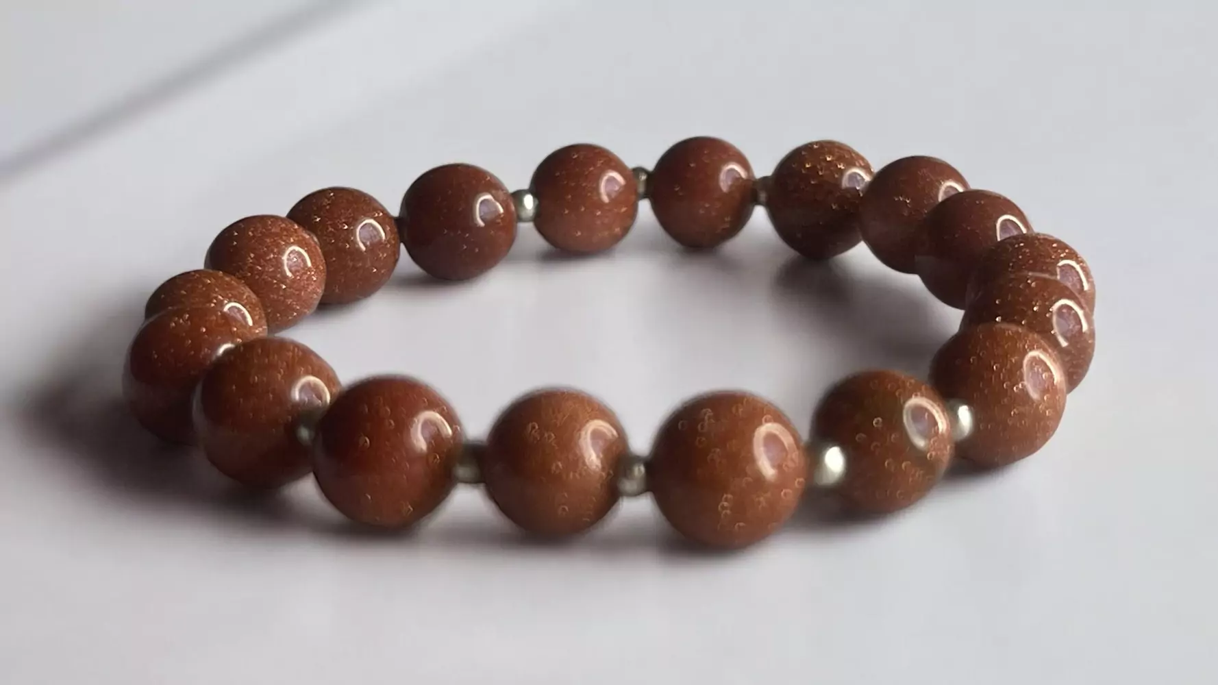 Pulsera piedra sol con perla metálica